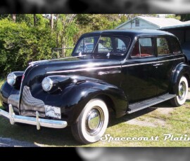 1939 black Buick 8 sedan restored and chrome plated bumpers, grill, headlight rings, nose and hood trim, wheel rings, hubcaps, running board trim, and exterior trim and accessories by Spacecoast Plating