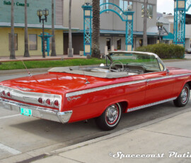 1962 Chevrolet Impala convertible (rear 3/4 view) displays bumper, taillight surrounds, trunk and batwing fin trim, emblem, antennas, windshield trim, door trim, mirrors, aluminum quarter panel trim, and fender spears restored and chrome plated by Spacecoast Plating.