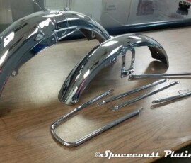 Motorcycle fenders and parts like fenders, mudgard stays and spears look brand new after metal restoration and chrome plating at Spacecoast Plating and Metal Refinishing, Inc.