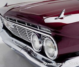 Detail of 1961 Impala SS Coupe front 3/4 detail view displays bumper, grille, emblem, headlight rings, and hood and fender trim restored, polished and plated by Spacecoast Plating.