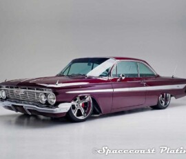 1961 Impala SS Coupe front 3/4 view displays bumper, grille, headlight rings, emblem, hood and fender trim, windshield and window and door trim, mirrors, aluminum body trim and emblems restored and chrome plated by Spacecoast Plating.