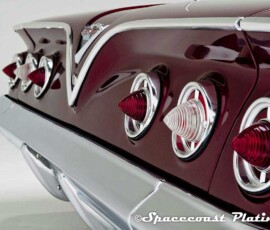 Detail of 1961 Impala SS Coupe rear 3/4 shot displays bumper, taillight rings, emblem, and trunk deck trim restored, polished and plated by Spacecoast Plating.