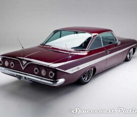 1961 Impala SS coupe rear 3/4 shot displays bumper, taillight rings, emblem, trunk deck trim, radio antennas, side molding adn fender spears, window & door trim restored and chrome plated by Spacecoast Plating.