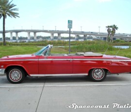 1962 Chevrolet Impala convertible side shot displays body trim, window and door trim, dual antennas, emblems, rocker panels and hubcaps that were restored and chrome plated by Spacecoast Plating in Melbourne FL.