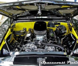 Engine bay of muscle car displays engine components that have been chrome plated by Spacecoast Plating.