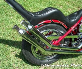 Detail of motorcycle exhaust pipes, rear wheel, and chain guard chrome plating - Spacecoast-plating.com