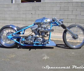 The Bruiser, a Custom chrome plated by Spacecoast-plating.com in Melbourne FL, emphasizes a stripped-down look with high-contrast chrome and rigid blue frame.