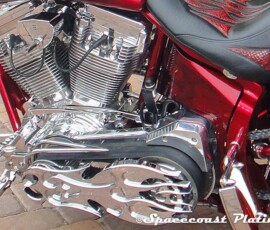 Close-up of engine components and custom flame design primary drive cover for an open belt drive, plated by Spacecoast Plating and Metal Refinishing Inc.