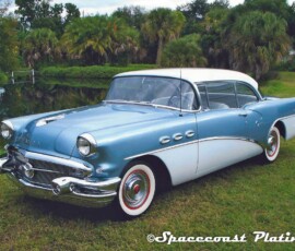 Front driver side view of 1956 two-tone Buick coupe bumpers, trim, wheel covers metal restoration, refinishing and chrome plating by Spacecoast Plating.