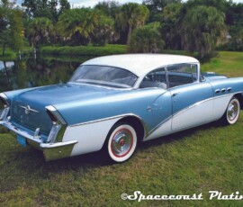 Rear side view of 1956 two-tone Buick coupe bumpers, trim, wheel covers metal restoration, refinishing and chrome plating by Spacecoast Plating.