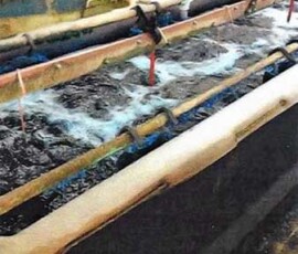 Pieces in the appropriate copper solution undergoing metallic electrolysis.