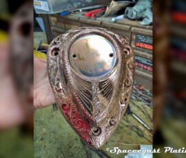 Intricately engraved mtorocycle engine shield plated chrome plated at Spacecoast Plating.