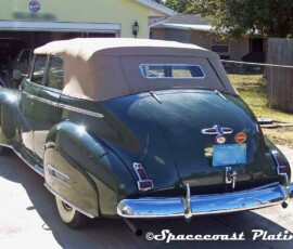 View of rear bumper, taillight surrounds, wheel rings and hubcaps, body trim and accessories restored and chrome plated by Spacecoast Plating on this green 1941 Buick convertible.